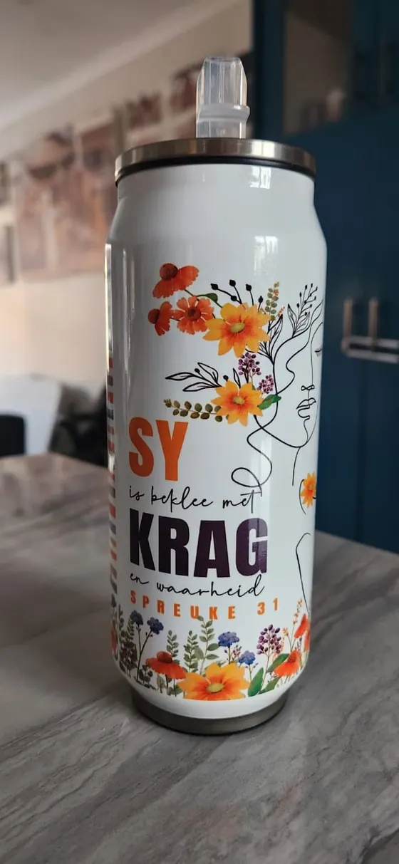 Tall tumbler printed Sy is beklee met krag en waarheid, Spreuke 31, with a line-art face and wildflowers