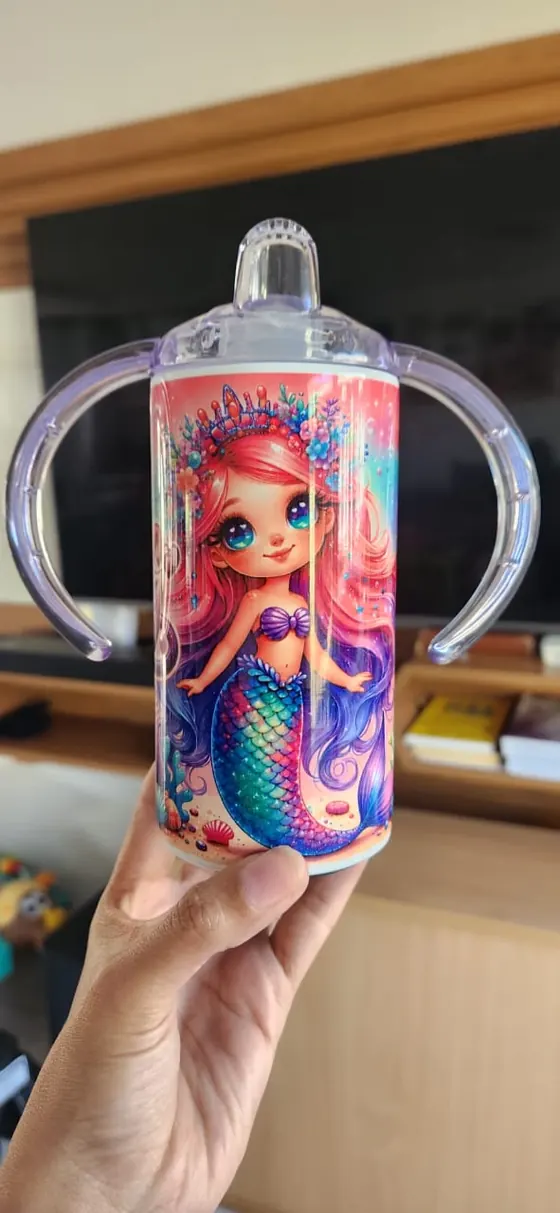 Kids sippy cup with two handles printed with a mermaid and an underwater scene
