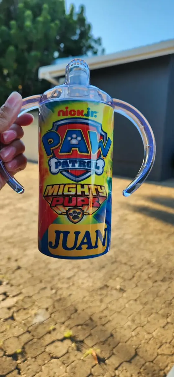 Kids sippy cup with two handles printed with a cartoon rescue puppy badge and the name JUAN
